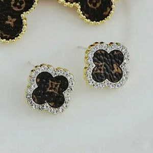 UP cycled L V leather earrings Swarovski accent